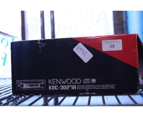 A boxed Kenwood car radio/CD player 