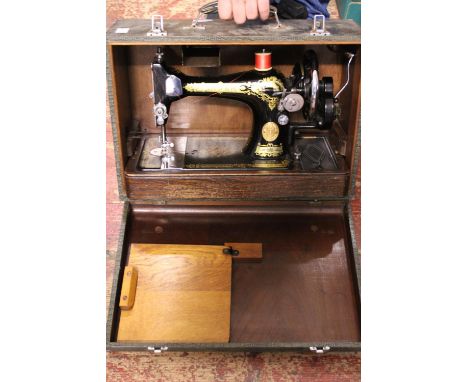 A antique manual singer sewing machine in case. Shipping unavailable 