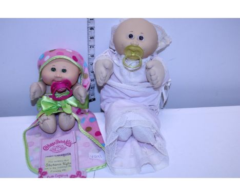 A vintage Cabbage Patch doll and one other with certificate 