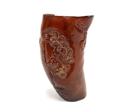 Chinese horn libation cup carved with a tree and a woman playing a flute, height 10.5cm.