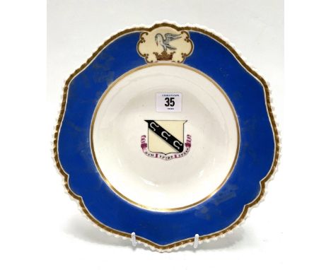 A 19th century Chamberlains Worcester armorial shallow bowl with blue ground, the central armorial with the motto DUM SPIRO S