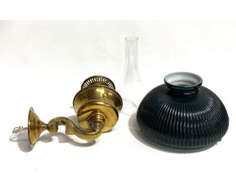 Brass oil wall lamp (converted) with a green and white circular opaque shade.