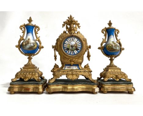 French gilt Spelter and porcelain clock garniture, the two-train clock with 3in painted porcelain dial, the movement stamped 