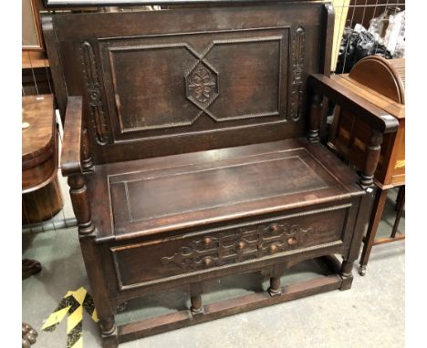 Replica oak carved monk's bench, width 100cm.