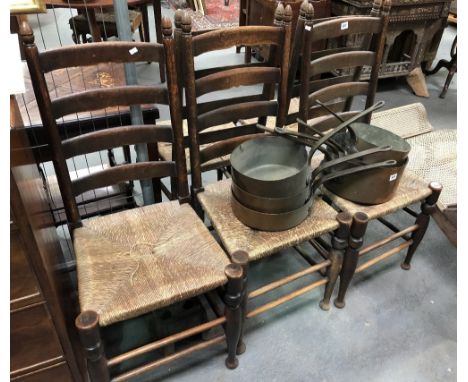 Set of five oak brush seat ladder back chairs.