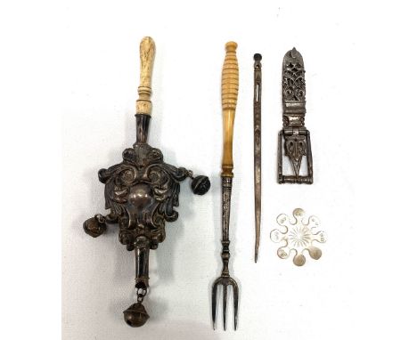 Miscellaneous items, including a silver embossed baby rattle with bone handle, a pickle fork with bone handle, etc.
