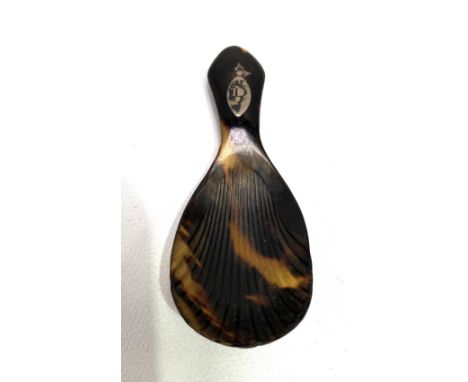 A George III tortoiseshell caddy spoon with shell bowl, inlaid silver cartouche monogrammed 'D', length 7.5cm.