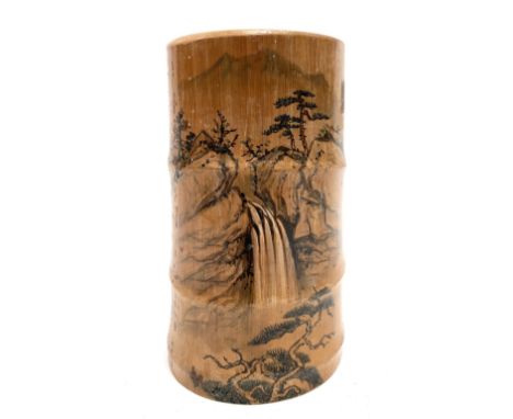 A Chinese bamboo brush pot painted with a mountainous landscape with waterfall, calligraphy inscription and red seal mark, he