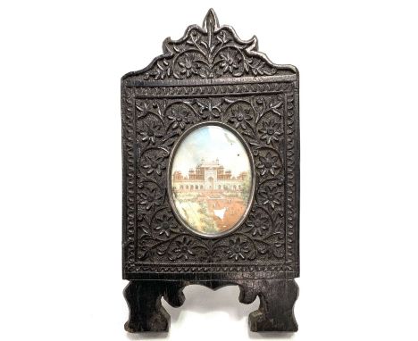 19th Century Indian miniature watercolour on ivory depicting the Taj Mahal and within carved ebonised frame, height of frame 