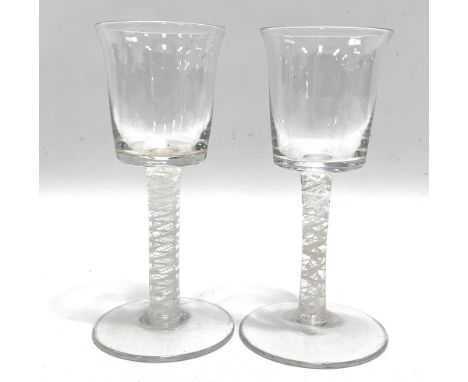 A good pair of Georgian wine glasses with white opaque air twist stems and on circular foot, height 16.5cm.