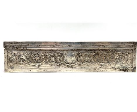 A French silver plate on copper rectangular hinge lidded box, the lid embossed with Mozart playing to Madame de Pompadour wit