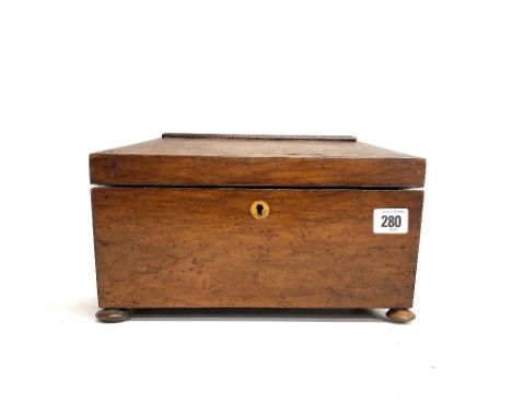 A 19th century walnut sarcophagus form three section tea caddy on ball feet, width 30cm (lacks glass mixing bowl).