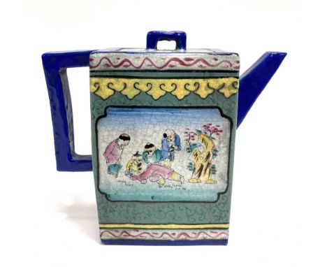 A Chinese Yizing glazed rectangular section teapot, decorated with opposing reserves of children playing, height 13cm.