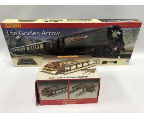Modern Hornby OO gauge train set 'The Golden Arrow'; together with Hornby Railways boxed London Road station R331 within box 