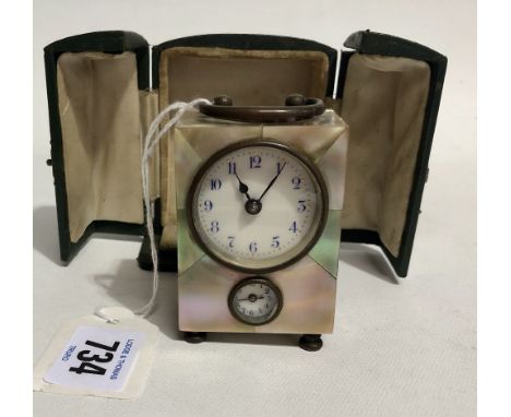 Miniature mother of pearl cased travel alarm clock with carrying handles and two dials and within green Moroccan leather case