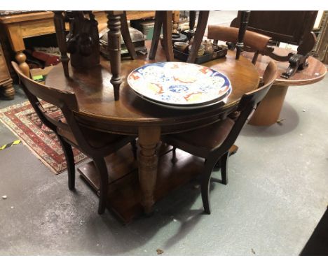 Victorian oak oval extending dining table with two extra leaves raised on four turned feet and ceramic castors, length extend