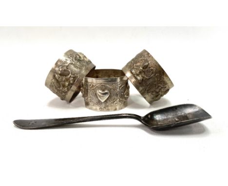 Silver plated White Star Line caddy spoon; together with three continental white metal napkin rings.
