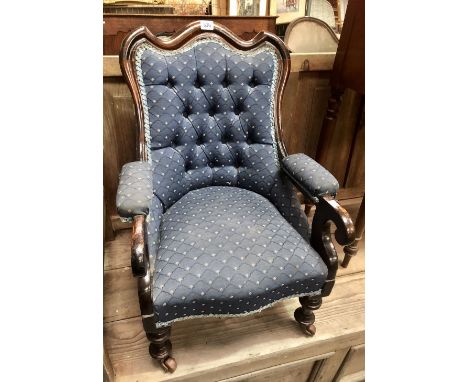 Victorian mahogany button back upholstered child's salon chair raised on turned forelegs and ceramic castors, height 66cm.
