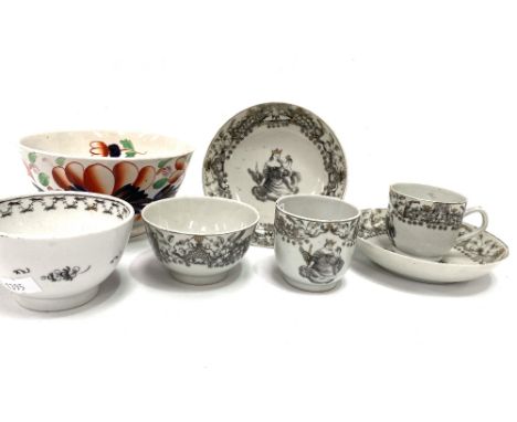 A pair of 18th century Chinese export black and white teacups and saucers with gilded highlights, together with a matching te