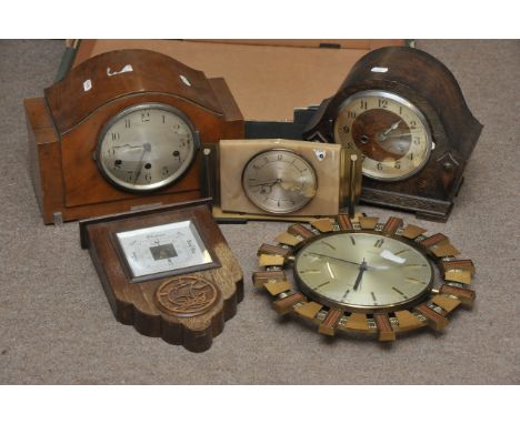 Four clocks and a small barometer