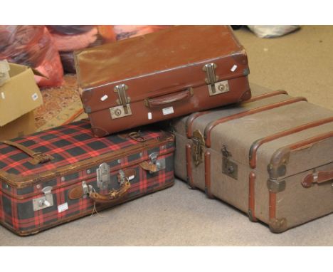 A vintage travelling trunk and two old cases