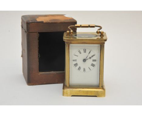 A cased brass carriage clock with key