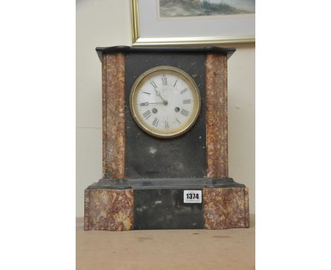 A late Victorian black slate and marble mantel clock fitted with a French movement striking on a bell