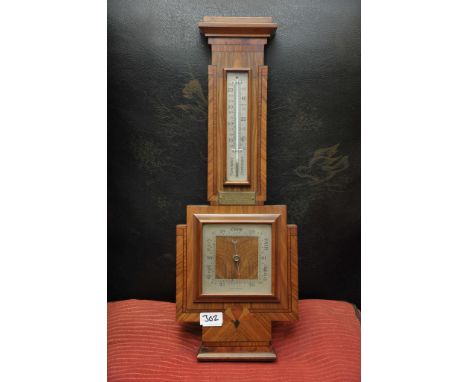 An inlaid wall barometer
