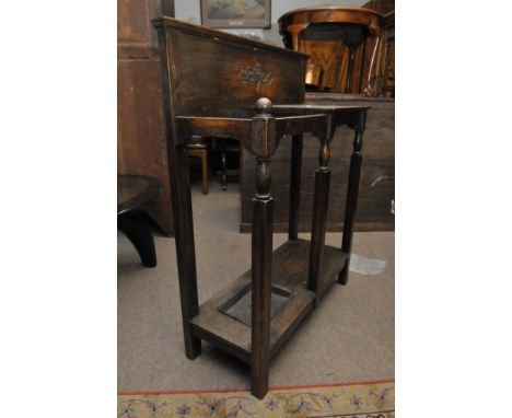An oak stick stand with open sections
