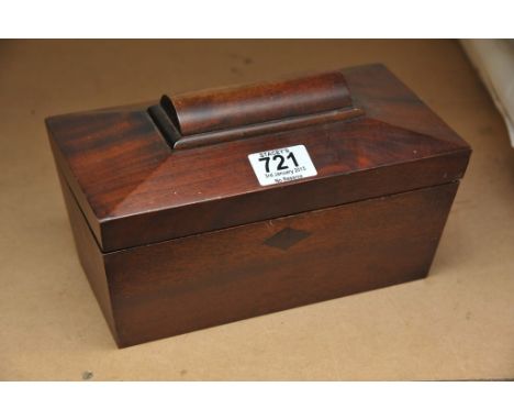 A mahogany twin compartment tea caddy of sarcophagus shape