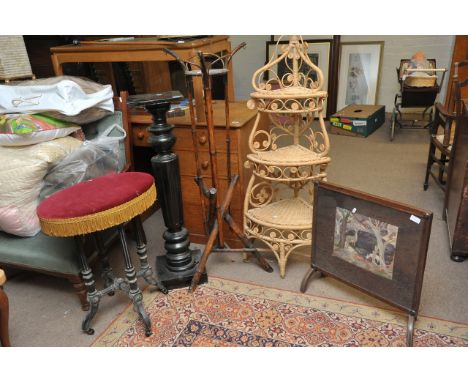 A torchere, stool on casters, two plant stands and a firescreen