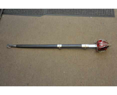 A dress sword having pierced basket hilt lined with red fabric and straight blade within a black scabbard