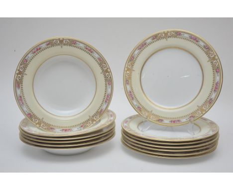 A collection of thirteen Spode Copeland plates and soup dishes with floral and gilt decorated rims