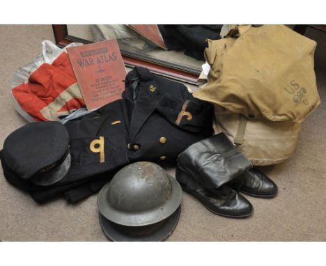 A canvas bag and one other containing military uniforms, pair of  boots, helmet and gas mask including naval jackets