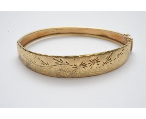A ladies 9ct gold bangle