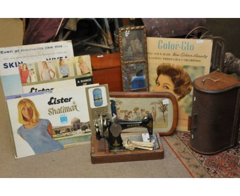 A wooden sewing box, sewing machine, vintage knitwear advertising boards and other items