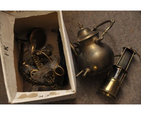 A box containing an assortment of brass ware including kettle on stand small miners type lamp and other oddments