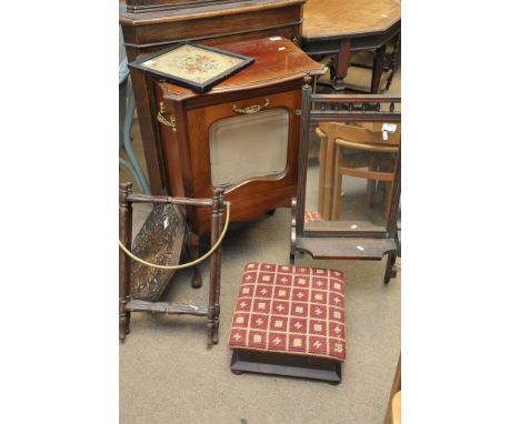 A cabinet converted into a magazine rack, folding table with top carved with leaves, mirror, tapestry stool, wall light fitti