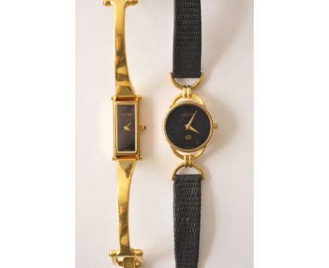 A gold plated Gucci bangle 1500L wristwatch together with a Gucci 6000L wristwatch