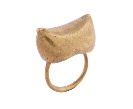 A GOLD COLOURED DRESS RINGThe shaped panel with a textured surface, stamped 750 with unidentified maker's markSize/dimensions