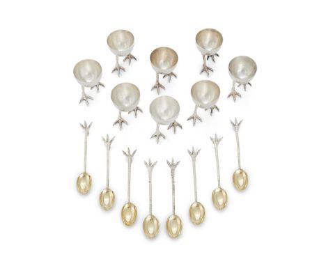 A SET OF EIGHT SILVER CHICKEN LEG EGG CUPS AND SPOONS ASPREY OF LONDON, LONDON 2013 The spoon bowls gilt the cups 5cm (2in) h