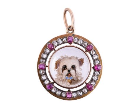 A LATE VICTORIAN ESSEX CRYSTAL PENDANT OF A LONG HAIRED TERRIER  CIRCA 1890The circular cabochon Essex crystal carved with a 
