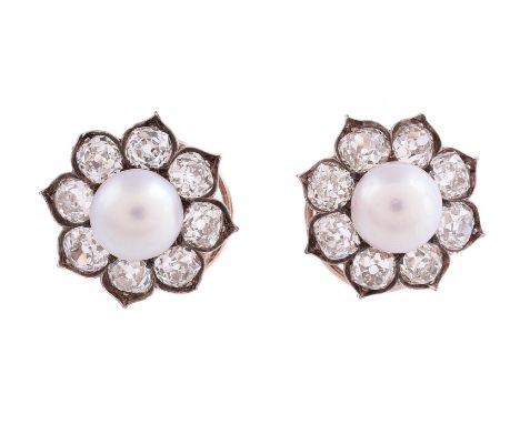 A PAIR OF VICTORIAN DIAMOND AND HALF PEARL EAR STUDS CIRCA 1880The central bouton pearl with in a surround of old mine cut di