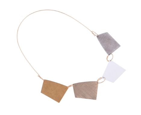 A FRENCH GOLD COLOURED AND MIXED METAL MODERNIST PANEL NECKLACEThe four shaped geometric panels with varying textures, one wi
