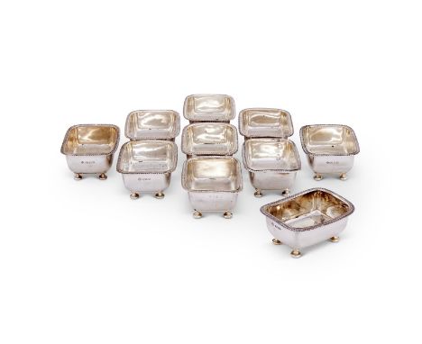 A SET OF EIGHT SILVER OBLONG SALT CELLARS ASPREY PLC, LONDON 1987 (4) AND 1990 (4) With gadrooned borders and on four bun fee