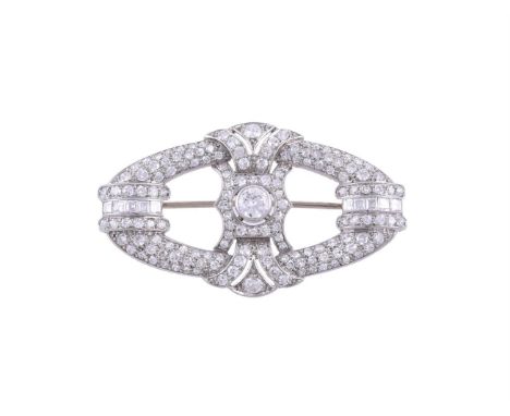 AN ART DECO DIAMOND BROOCH CIRCA 1930The pierced oval brooch set with eight cut, old brilliant cut and step cut diamonds, app