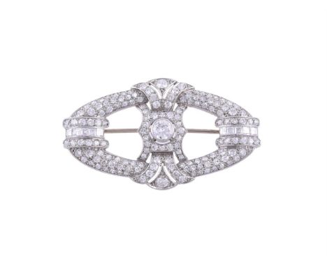 AN ART DECO DIAMOND BROOCH CIRCA 1930The pierced oval brooch set with eight cut, old brilliant cut and step cut diamonds, app