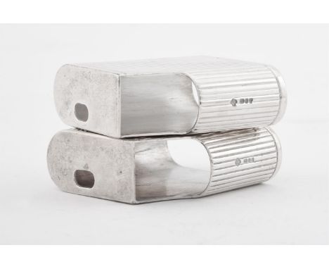 A PAIR OF SILVER GAS LIGHTER COVERS ASPREY PLC, LONDON 1995With reeded decoration5cm (2in) high97g (3.1 oz)Provenance: from t