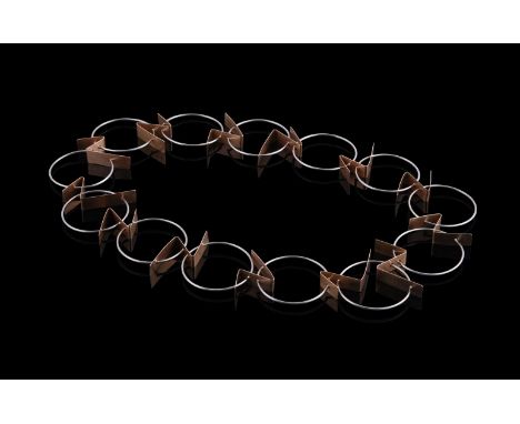 DOROTHEA PRÜHL, HAKEN, A GOLD COLOURED AND STAINLESS STEEL NECKLACE CIRCA 2011The stainless steel circular links with lightni