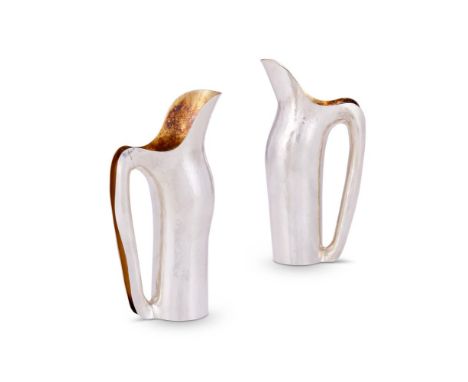 A PAIR OF DANISH HAMMERED SILVER COLOURED KANDE 5 JUGS CLAUS BJERRING ANDERSEN, 21ST CENTURY Inspired by water, the jug and h